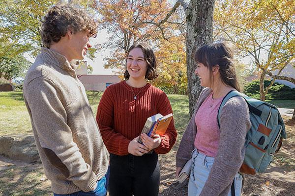 students talking outside